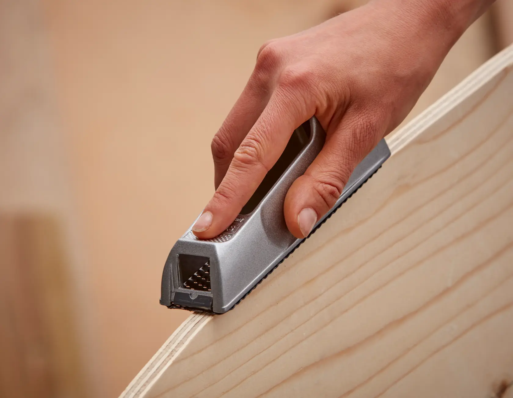 Photo of STANLEY 5-21-399 hand planer smoothing wood edge, close-up view.