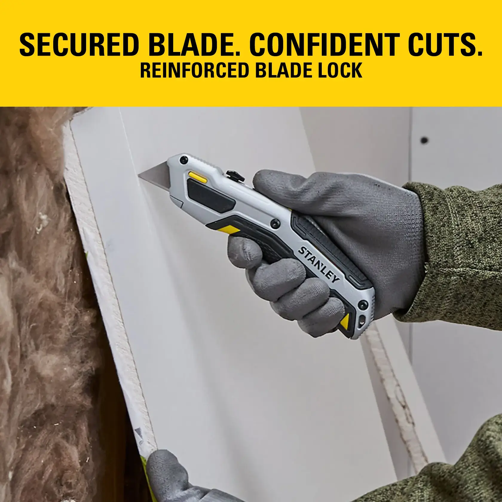 Stanley utility knife held with gloves, cutting drywall. Text highlights secured blade and reinforced blade lock.