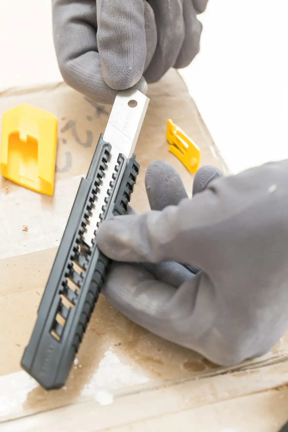 STANLEY 0-10-151 utility knife with black and yellow handle, side angle, white background.