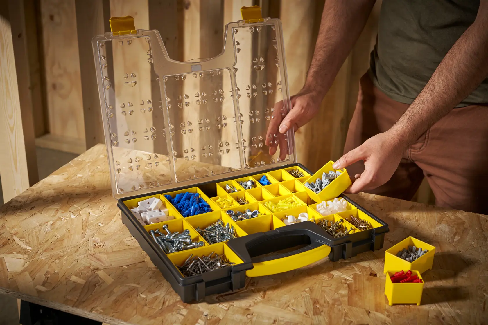 STANLEY 1-92-748 organizer with yellow compartments, open lid, assorted hardware, angled view.
