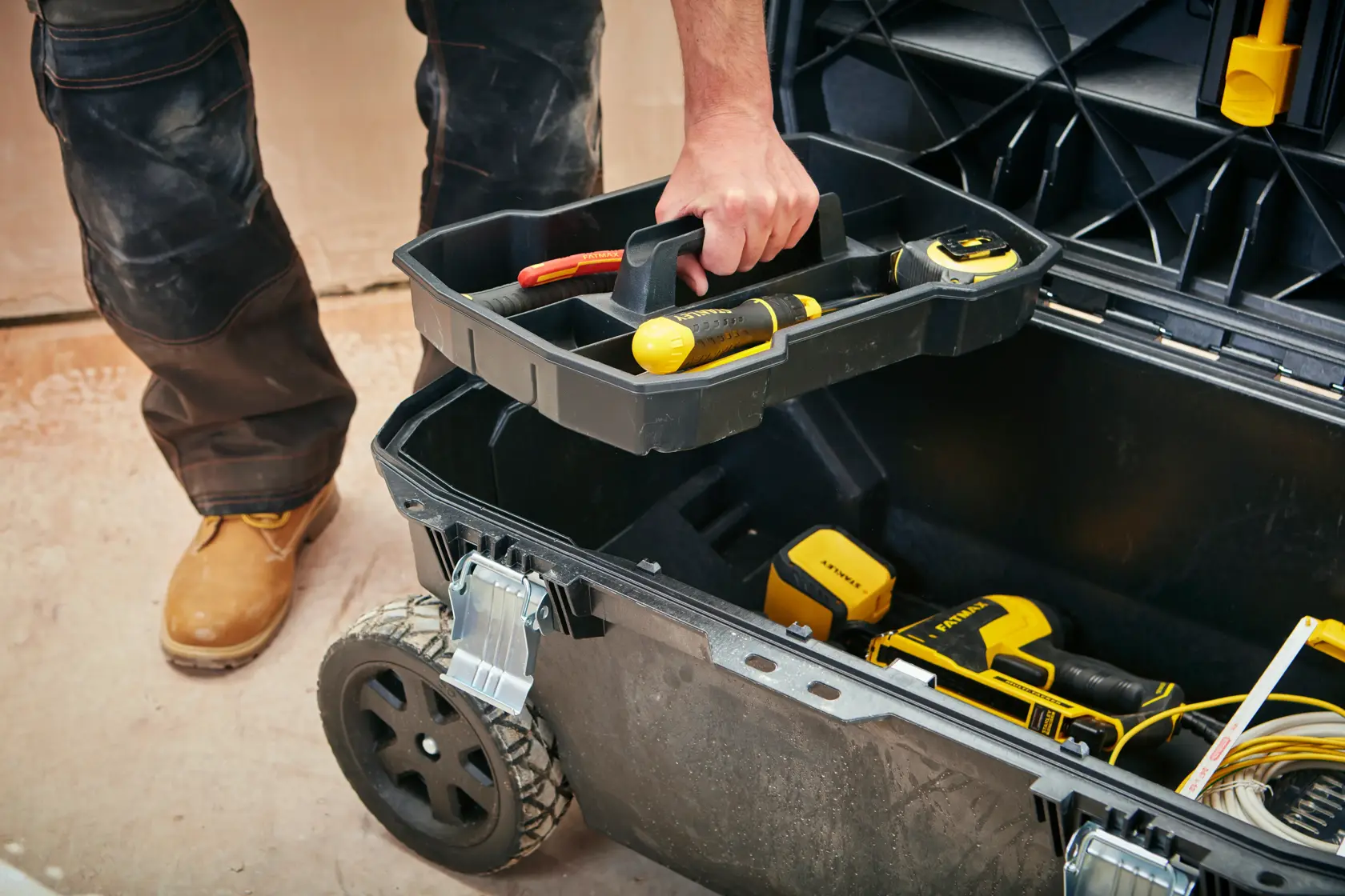 STANLEY 1-94-850 rolling toolbox with hand lifting inner tray, tools and accessories inside, shown from above.