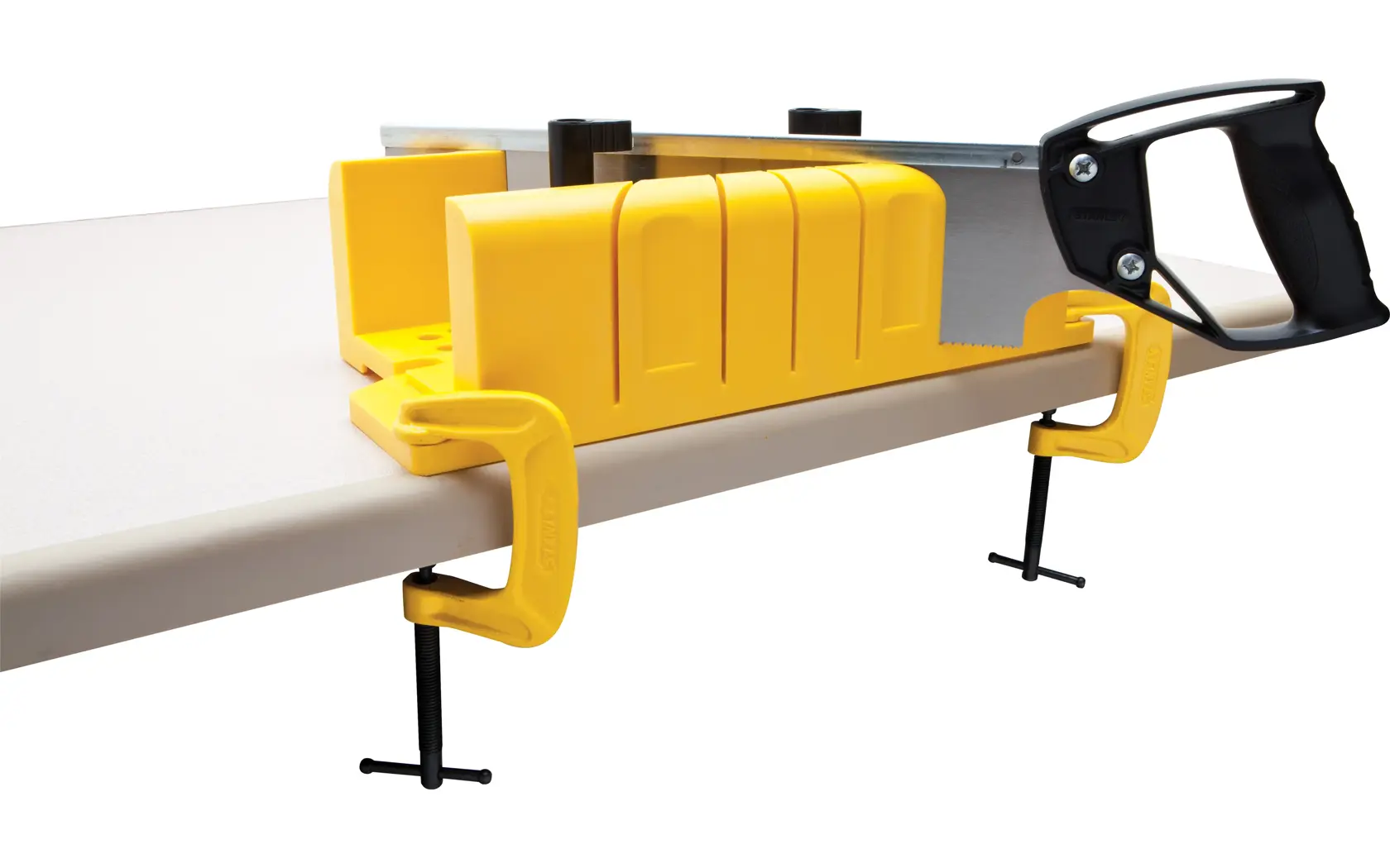 STANLEY 20-600 yellow miter box with clamps and hand saw, side angle on white background.