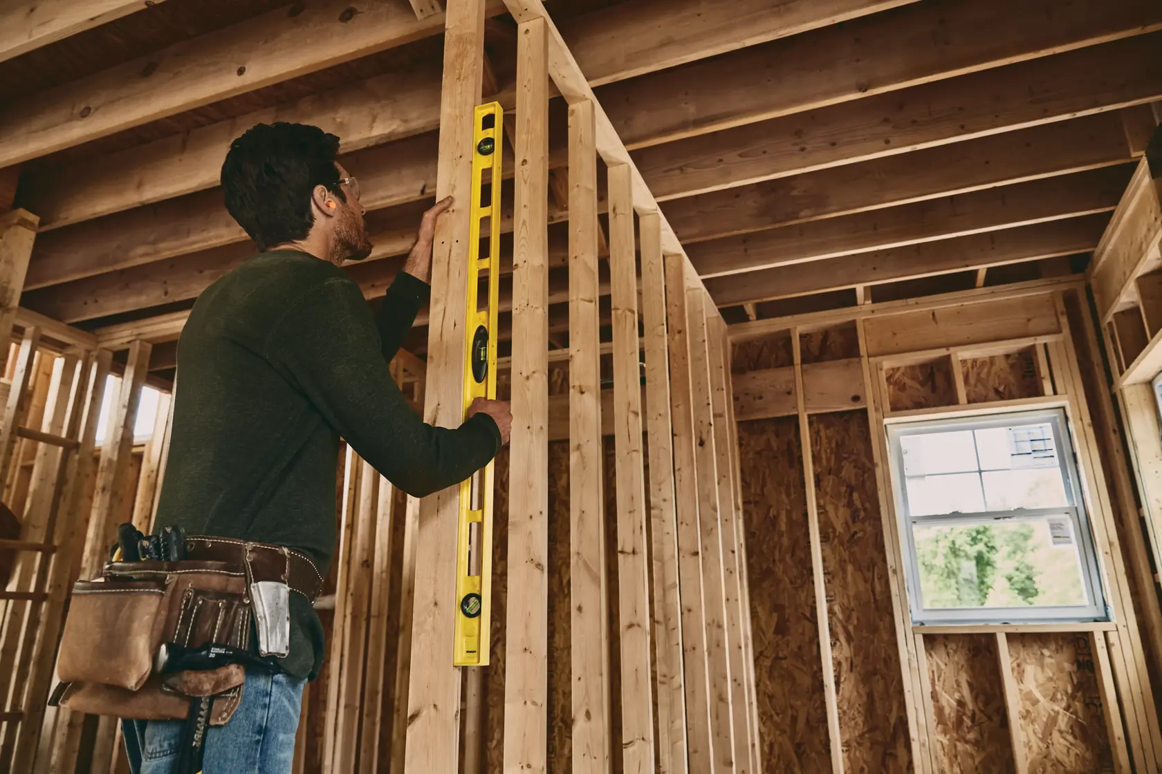 STANLEY 42-470 level tool in use on wooden framing, indoor construction, side angle.