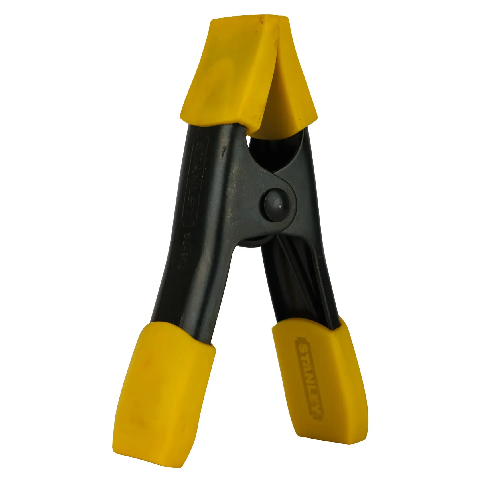 Stanley photography clamp with black body and yellow grips for securing items during photo shoots.