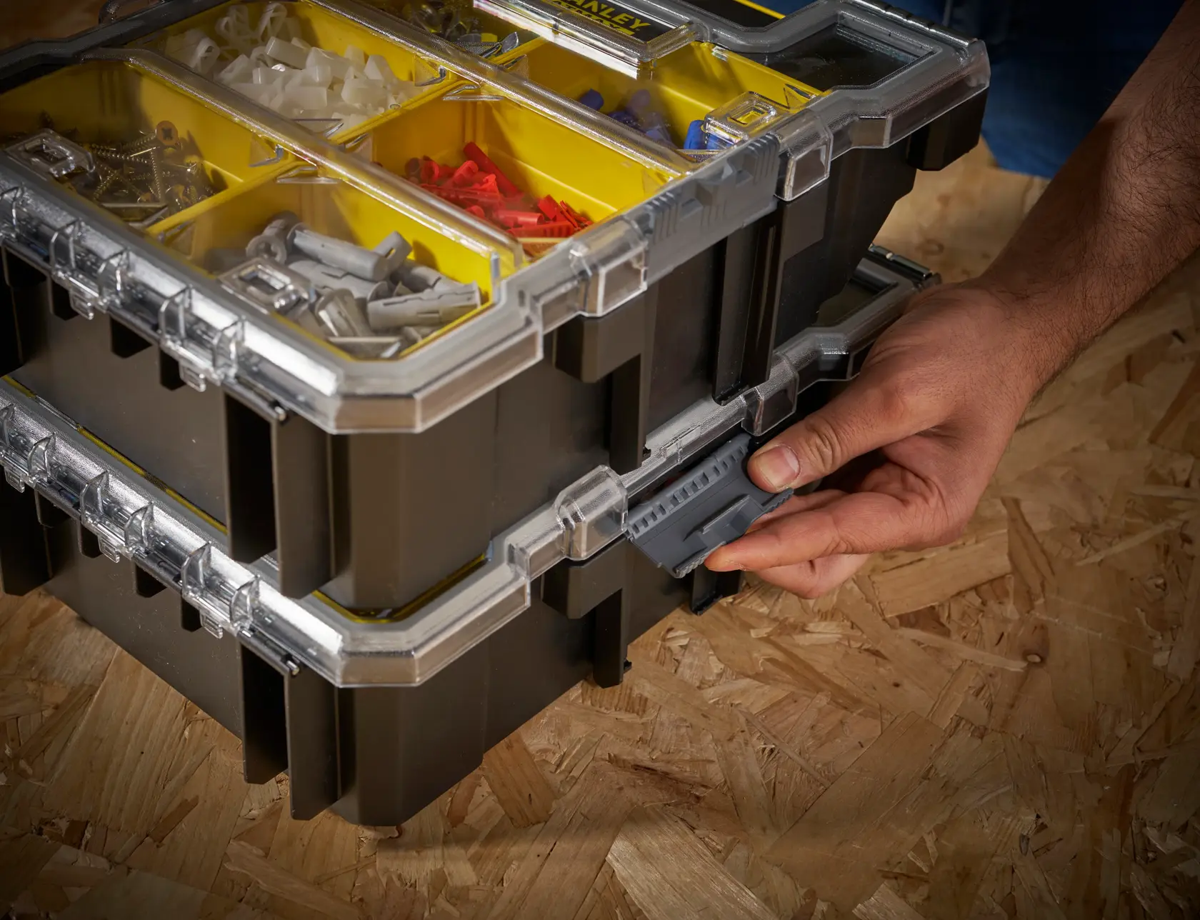 STANLEY FMST1-72378 organizer photo, stacked black and yellow boxes with clear lids and compartments.