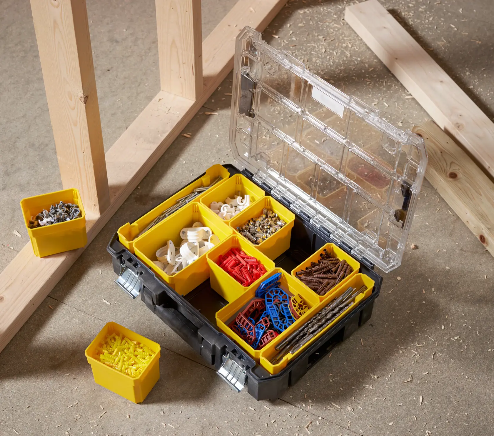 STANLEY FMST82967-1 organizer box with yellow compartments holding assorted hardware, top view.