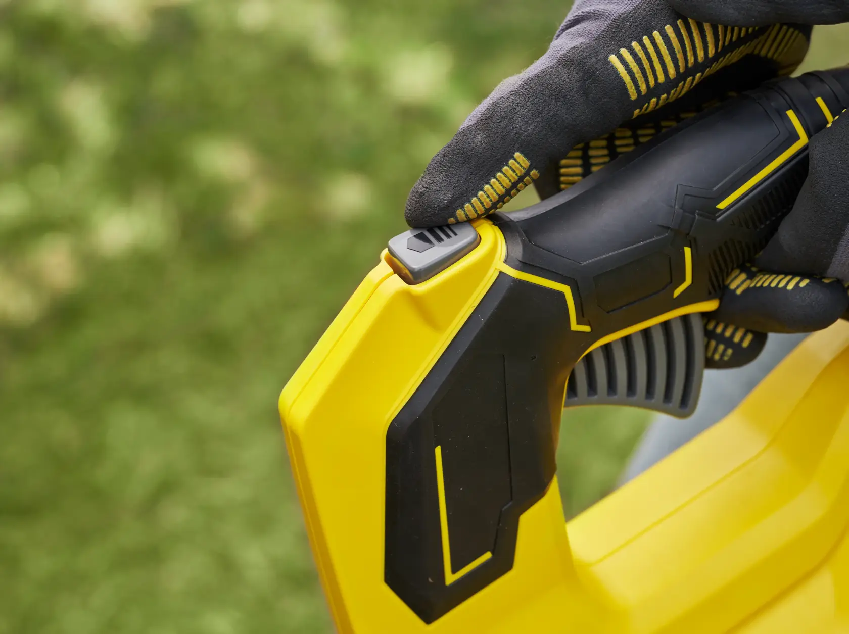 STANLEY SFMCBL730M1 blower handle close-up, yellow and black design, photographed outdoors.