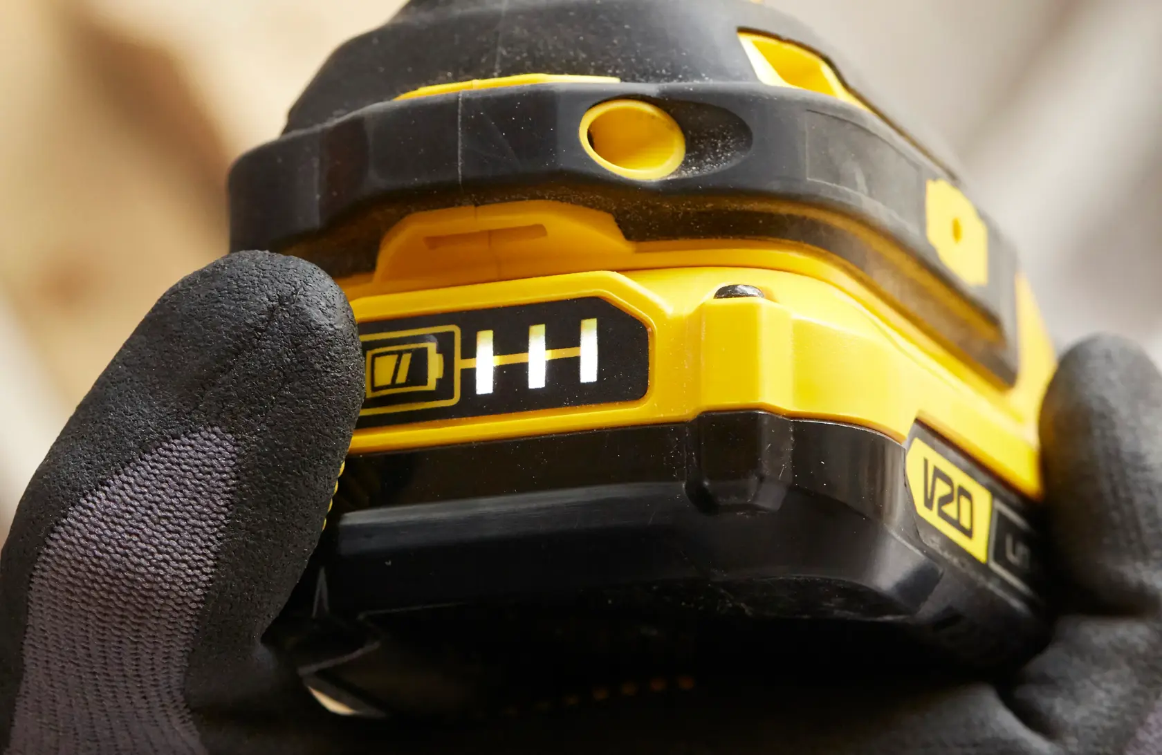Photo of STANLEY SFMCF800DM2 power tool grip showing V20 battery indicator close-up.