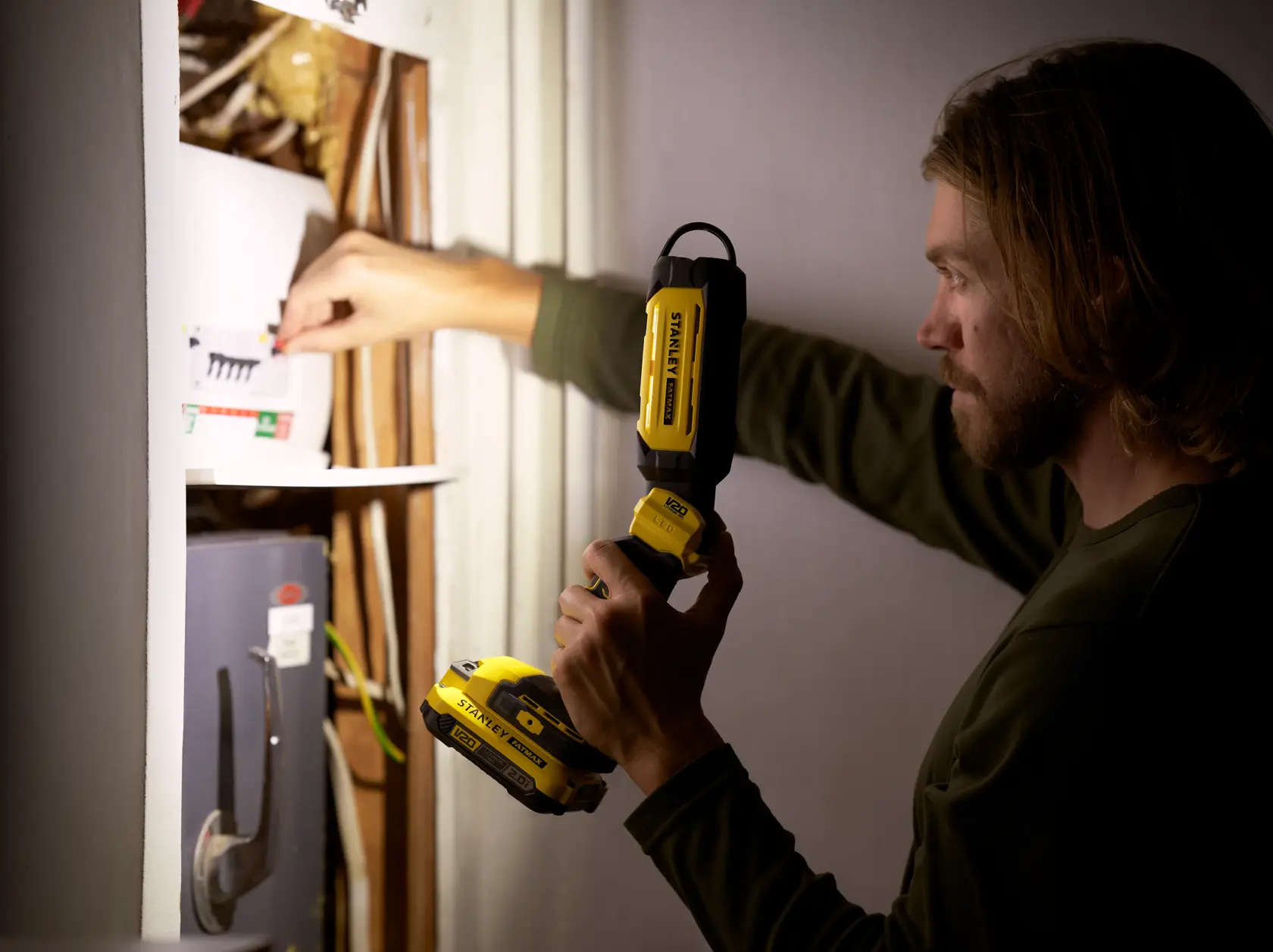 STANLEY SFMCL050B 18V STANLEY FATMAX V20 Pivot Light used to illuminate electrical panel.