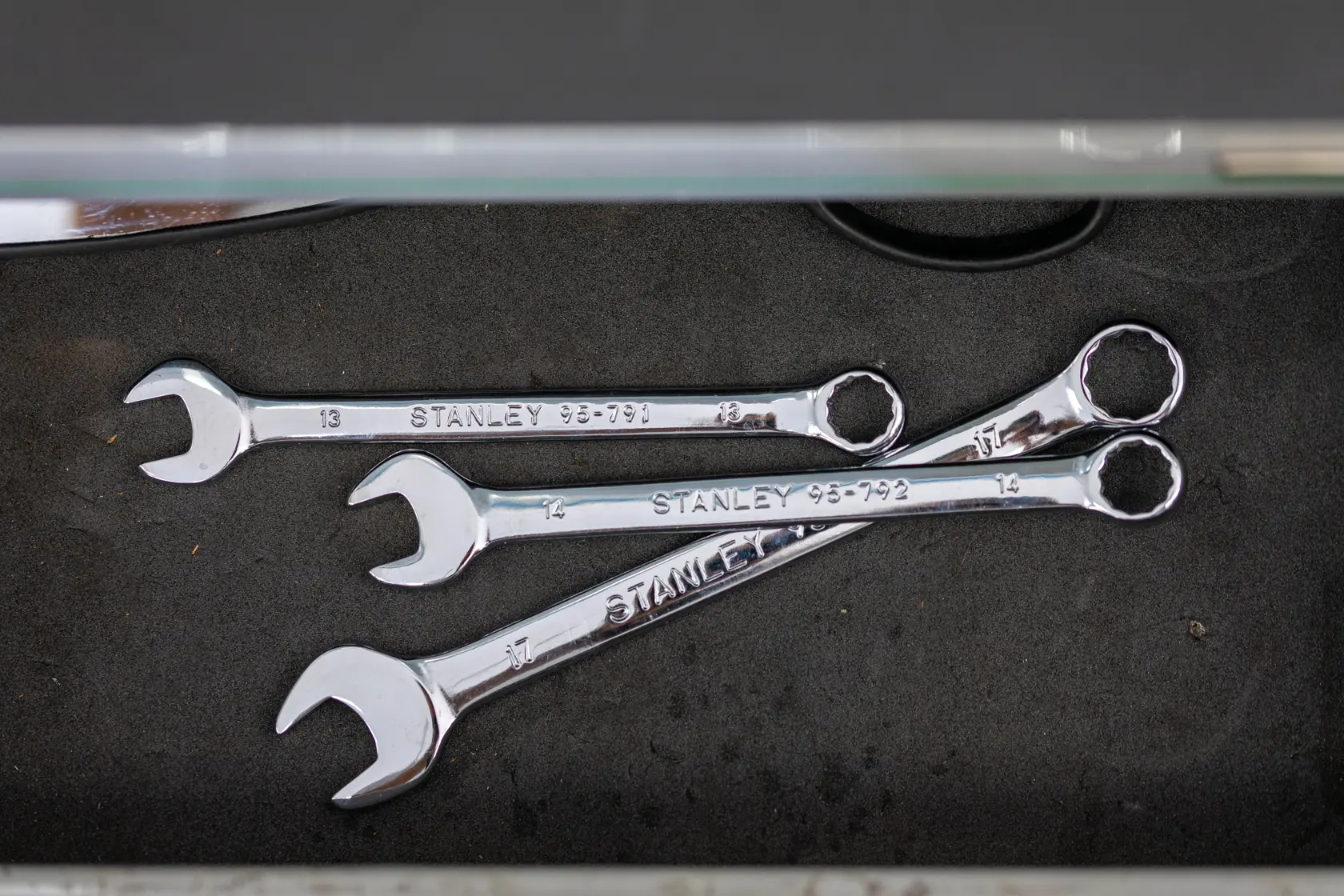 Photo of STANLEY STMT95910-0 combination wrenches in drawer, metallic finish, photography category.