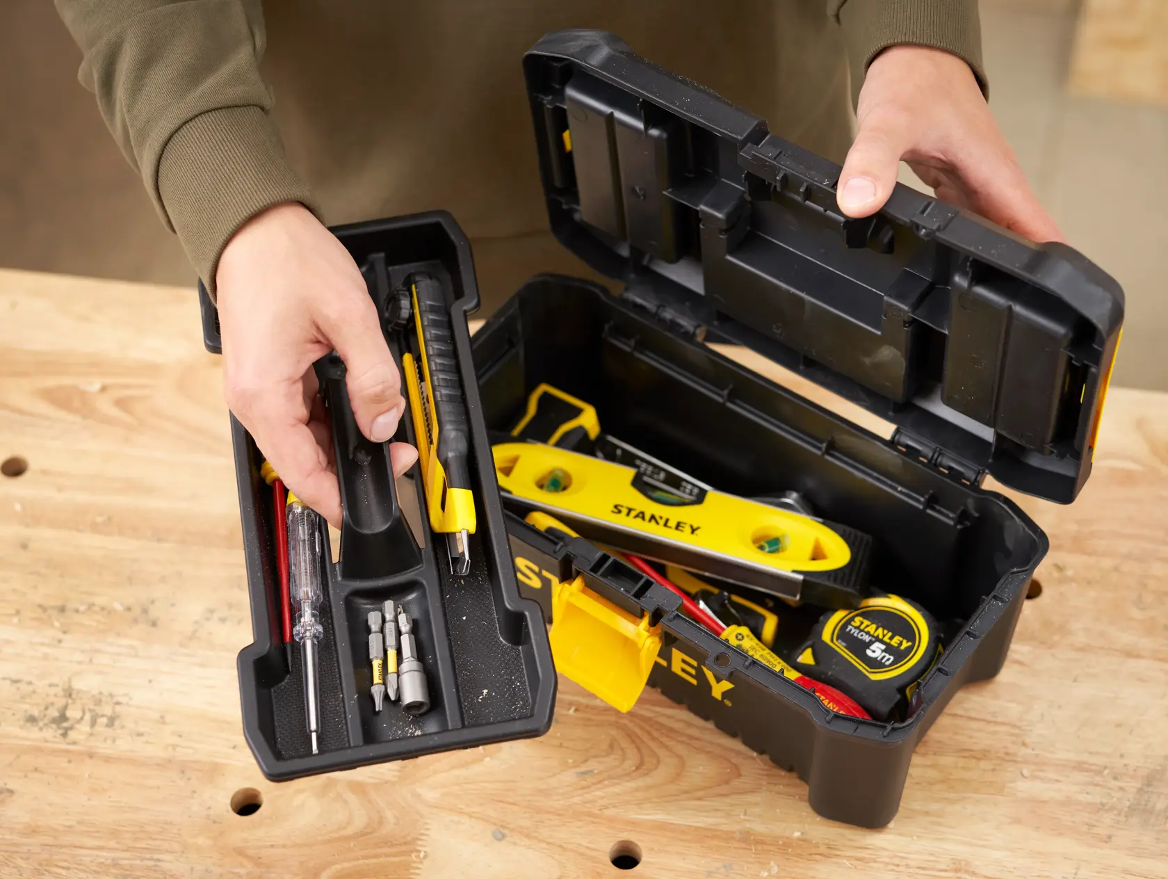 Photo of STANLEY STST1-75514 black toolbox with yellow accents, open to show assorted hand tools and accessories.