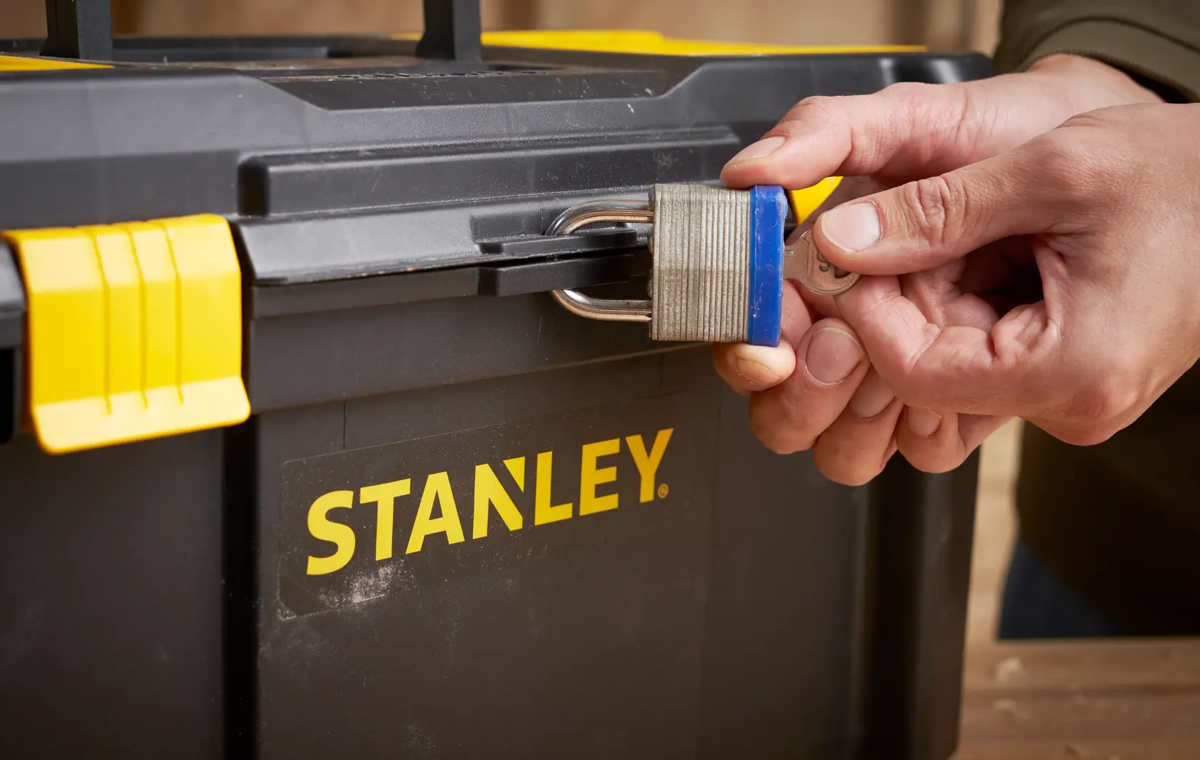 STANLEY STST1-75520 toolbox with padlock being locked, close-up photography of front latch.