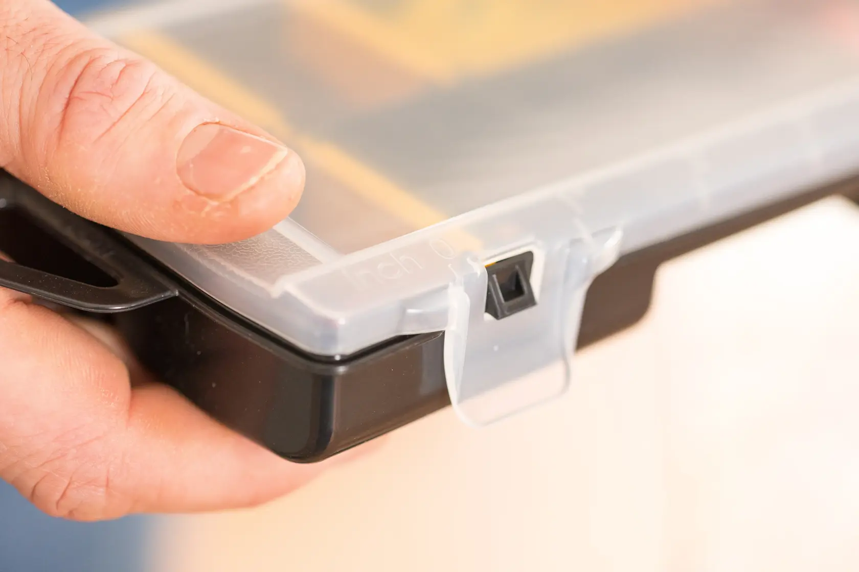 STANLEY STST81679-1 photography of clear latch on black storage box held in hand